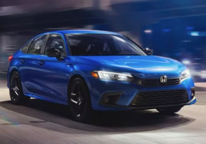 A 2024 Honda Civic driving down a street near Indianapolis, Indiana