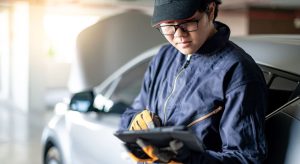 An auto service tech performing routine service near Indianapolis, Indiana.