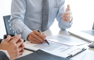 People discussing car financing at a dealership near Indianapolis, Indiana.