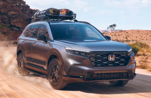 A 2024 Honda CR-V Hybrid driving down a dirt road near Indianapolis, Indiana.