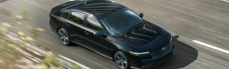 Black 2026 Honda Accord seen from above driving along a highway