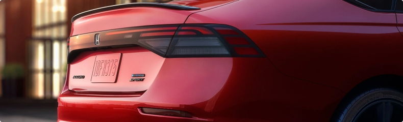 Close-up of the rear of a red Honda Accord Sport Hybrid showing its spoiler and badging
