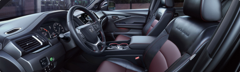 Front cabin of the Honda Ridgeline Black Edition with black and red leather-trimmed seats